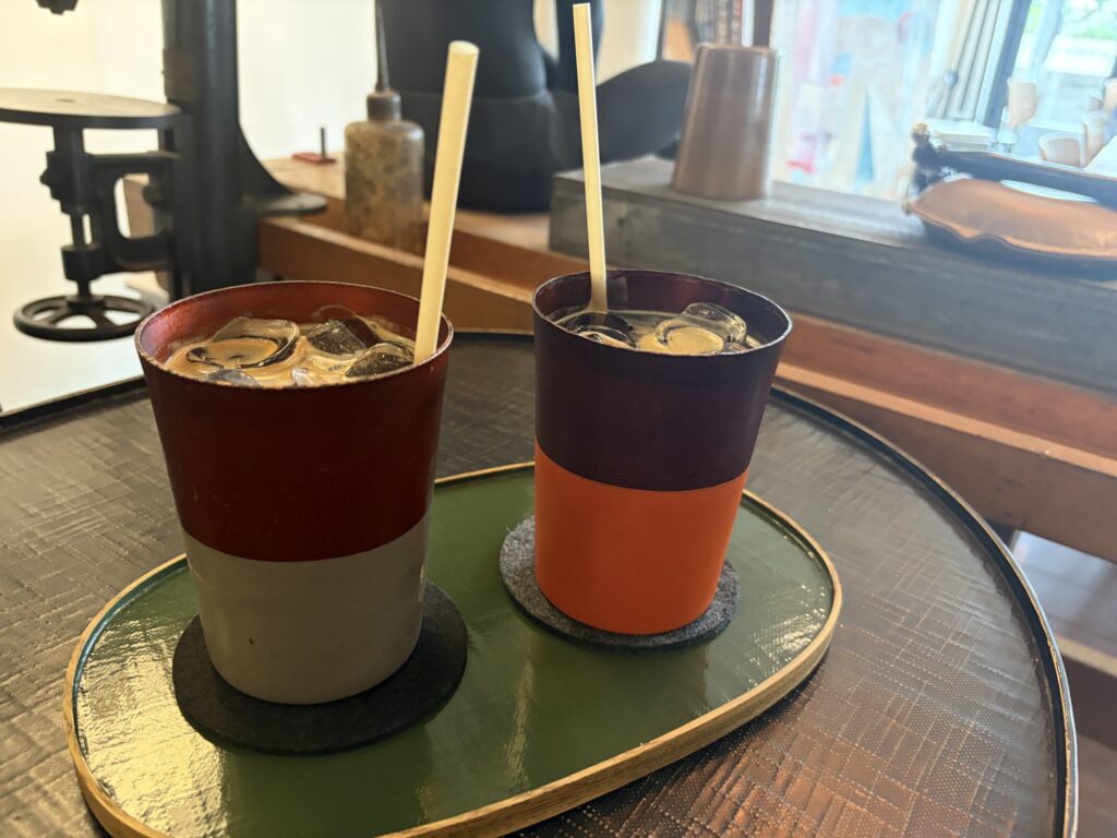 Iced coffee served in a handmade bronze cup at Hannam Workshop, Hannam-dong, Seoul.